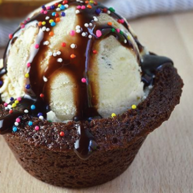 Brownie as a bowl with a scoop of ice cream and chocolate sauce